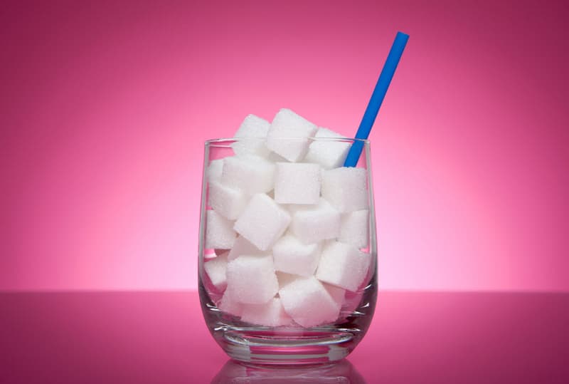 A glass full of sugar cubes.