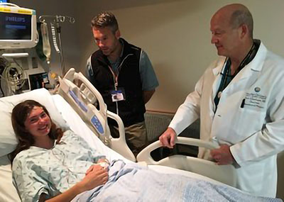 A teen girl in a hospital bed