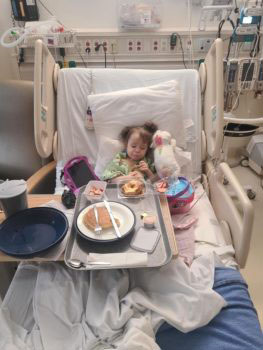 A toddler in a hospital bed