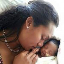 Angela holds newborn, DJ, who was born prematurely with EA and TEF