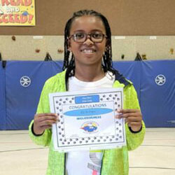 A boy holds a certificate