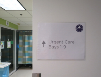 A sign in Seattle Children's Urgent Care department that reads "Urgent Care Bay 1-9"