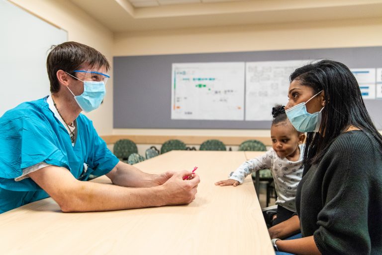 A doctor talks to a patient's family