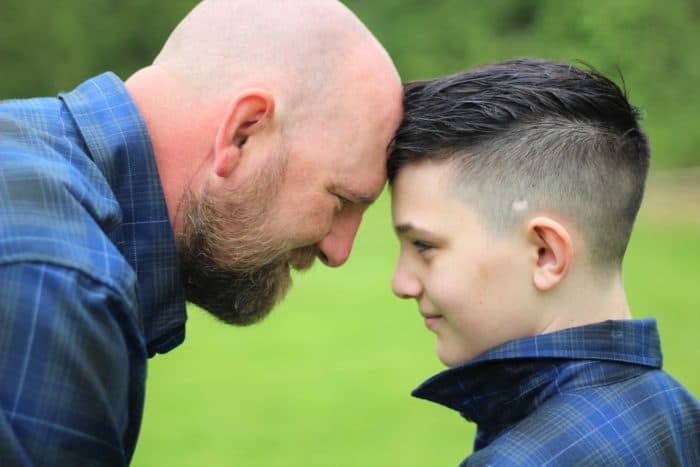 Ryder and his dad pose together.