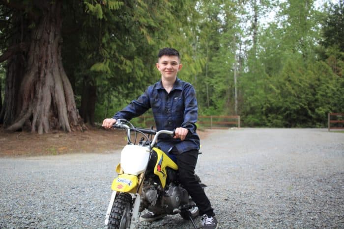 Ryder poses on a dirtbike.