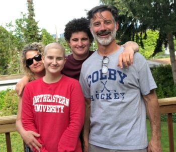 A family poses in the park