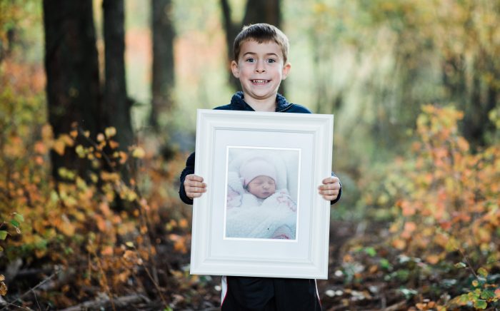 a boy holds a picture