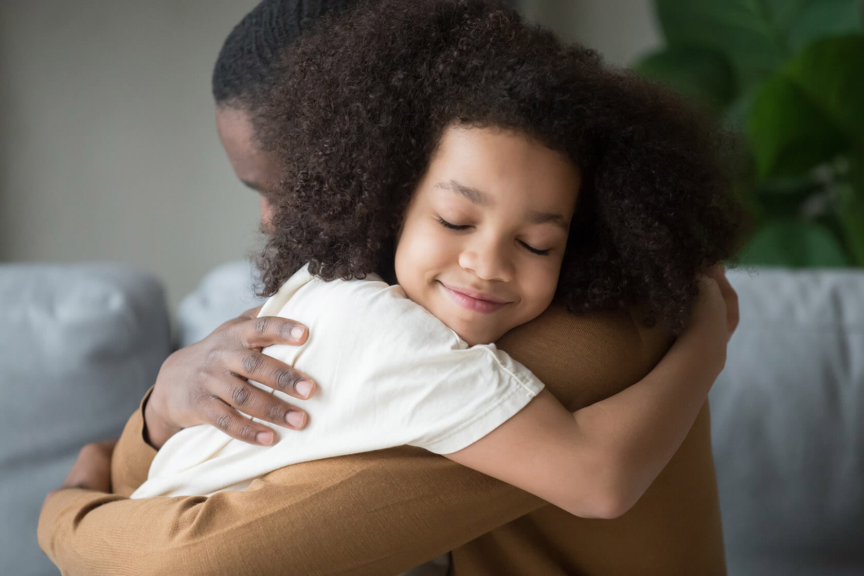 Child and parent hugging