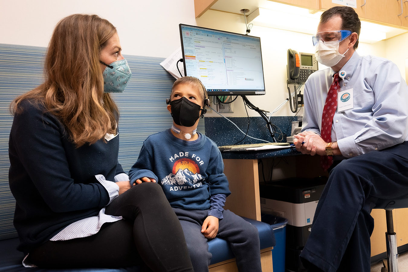 A mother and son speak with a Seattle Children's doctor