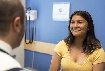 A Seattle Children's pediatric cardiology patient meets with a doctor