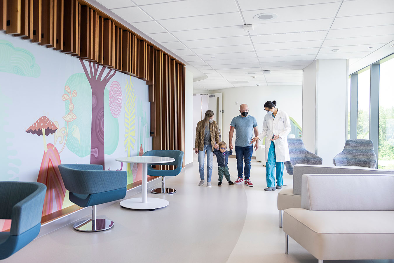 A doctor speaks to a family in a Seattle Children's hallway