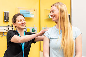 A teen girl is examined by a Seattle Children's provider