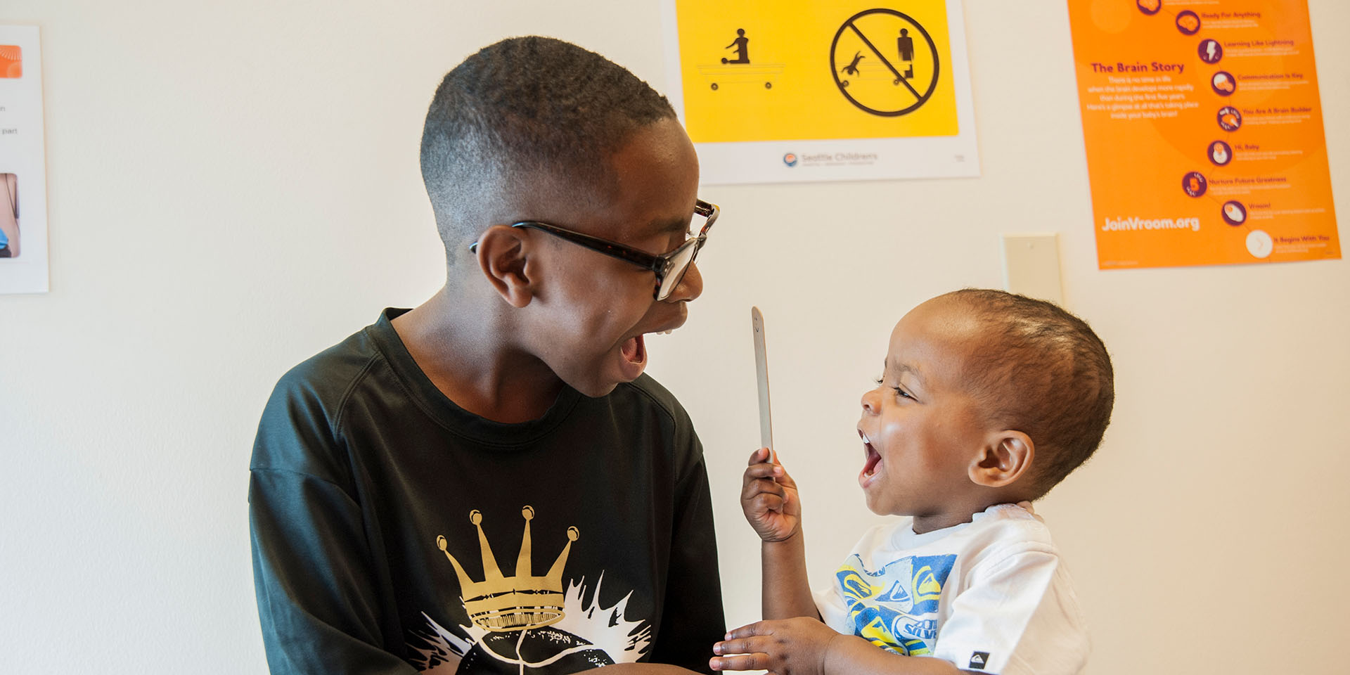 Brother look at each other at Seattle Children's