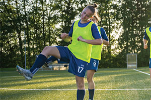 Teen girls performing dynamic warm-ups