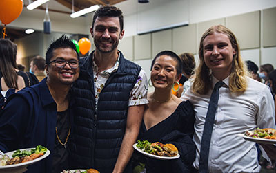 Residents pose the camera at an event