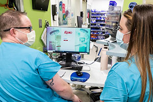 Nurses in front of a computer