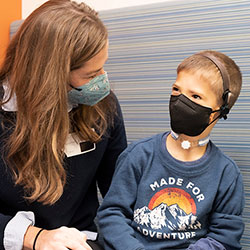 A boy looks at his mother at Seattle Children's