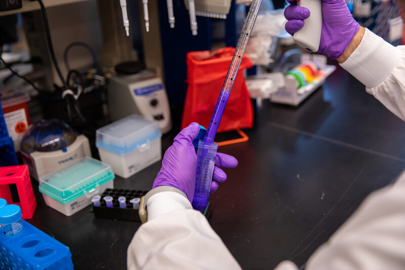 A researcher performing a lab test