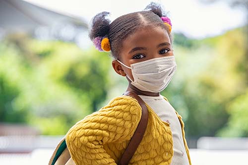 A girl wearing a mask.